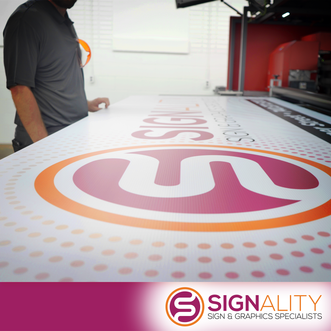Large Signality banner on the print table